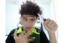 Youth Arrested After Photo of Him Holding a Knife & Showing Gang Sign Shared Online