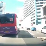 Naked Man Lies Flat in the Middle of a Busy Road; Driver Used His Car to Protect Man from Incoming Traffic