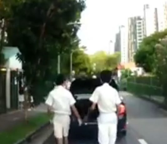 Parent Speeds Off After Dropping Off Kids; Car Boot Left Open with Their School Bags Still in the Boot