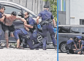 man-tries-bite-police-officers