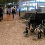 MOM Looking Into Claim Changi Airport Wheelchair Assistant Had S$5 Docked for Being 11 Seconds Late An empty wheelchair in a Singapore airport terminal departure hall