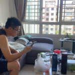 S’pore Is Testing Chat.gov.sg, a Chatbot for Official Government Information A man in a Singapore HDB living room looking at a smartphone