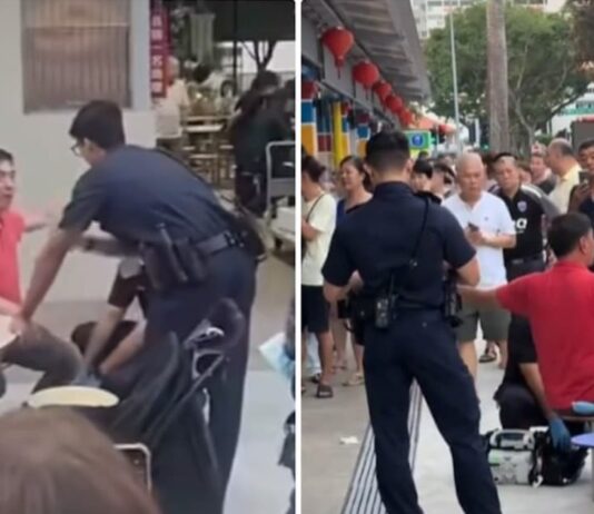 Huang Yiliang in a red polo shirt speaking with police at Circuit Road Hawker Centre after the assault