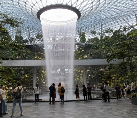 Indoor waterfall and forest canopy at Jewel Changi Airport