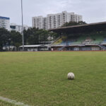 Keisuke Honda Has Been Unveiled at FC Jurong and Wants the Club to Win the SPL A football on the pitch at a Singapore stadium with HDB blocks behind the stands