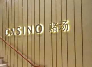 Pair Charged After 121 Fake $100 Notes With the Same Serial Number Were Found at MBS Marina Bay Sands casino entrance sign