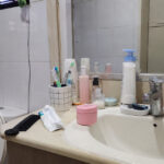 HSA Is Recalling a Medicube Cream in S’pore Over a Suspected Prohibited Ingredient A typical Singapore bathroom vanity with an unlabelled pink facial cream jar among everyday toiletries