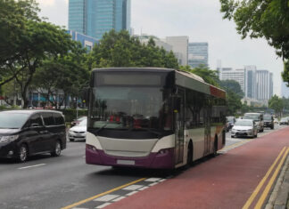 A Singapore public bus travelling in a dedicated red bus lane