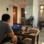 YouTube Premium Prices in Singapore Rise Again, Individual Plan Now S$15.98 a Month A person watching videos on a laptop in a Singapore HDB living room