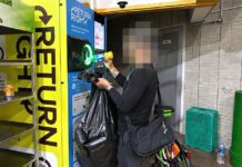 Singapore Man Collects Over S$1,000 From Discarded Cans And Bottles Under BCRS A man returning a bottle at a Return Right BCRS machine while holding a bag of collected cans