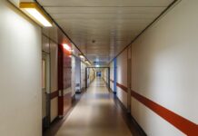 Married China Man Suffers Brain Haemorrhage After Sex With Female Colleague, Becomes Vegetative and Is Later Fired Hospital corridor illustration for Hebei labour dispute brain haemorrhage vegetative case