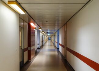 Married China Man Suffers Brain Haemorrhage After Sex With Female Colleague, Becomes Vegetative and Is Later Fired Hospital corridor illustration for Hebei labour dispute brain haemorrhage vegetative case
