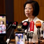 Sim Ann speaking at MFA press briefing on 52 Singaporeans detained in China