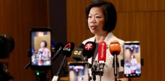 Sim Ann speaking at MFA press briefing on 52 Singaporeans detained in China