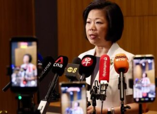 52 Singaporeans Arrested and Detained in China Over Suspected Pyramid Scheme Activities Sim Ann speaking at MFA press briefing on 52 Singaporeans detained in China