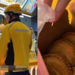 Meituan rider in yellow uniform buying curry puffs at PLQ Mall