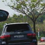 Singapore-registered car with smashed window at Desaru Waterpark car park