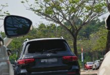 Singapore-registered car with smashed window at Desaru Waterpark car park