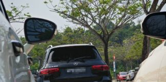 Singapore-registered car with smashed window at Desaru Waterpark car park