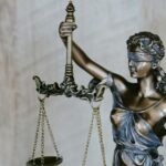 Non-literal courthouse scales and paperwork motif for elderly divorce maintenance judgment with no identifiable faces