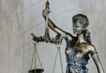 Man, 90, Fails to Get Maintenance From 89-Year-Old Ex-Wife After 64-Year Marriage; He Gets S$2.4 Million From Assets Non-literal courthouse scales and paperwork motif for elderly divorce maintenance judgment with no identifiable faces