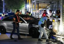 Mercedes Mounts Kerb Outside Esplanade, 2 Business Travellers Hurt; Driver Arrested for Suspected Drink-Driving Damaged Mercedes at Esplanade crash scene after mounting kerb and hitting tourists; suspected drink-driving arrest