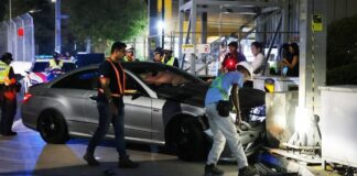 Damaged Mercedes at Esplanade crash scene after mounting kerb and hitting tourists; suspected drink-driving arrest