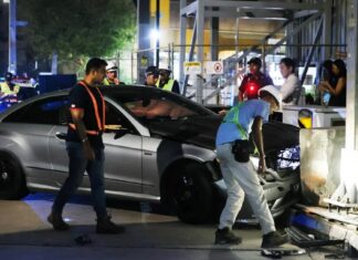 Damaged Mercedes at Esplanade crash scene after mounting kerb and hitting tourists; suspected drink-driving arrest