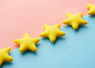 Five yellow stars illustrating online star ratings and fake review crackdowns