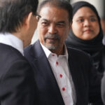 Former Malaysian minister Jamil Khir Baharom outside court over Tabung Haji charges