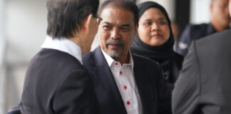 Former Malaysian minister Jamil Khir Baharom outside court over Tabung Haji charges