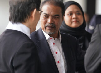 Former Malaysian minister Jamil Khir Baharom outside court over Tabung Haji charges
