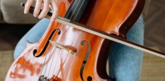 Person playing a cello, instrument close-up with no face visible, for a Jurong West neighbour noise dispute
