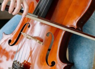 Person playing a cello, instrument close-up with no face visible, for a Jurong West neighbour noise dispute
