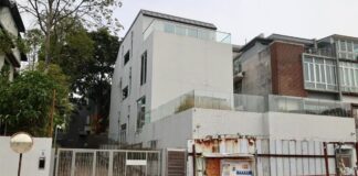 White Whitley Road bungalow under construction barriers involved in Kopitiam founder Lim Bee Huat contractor suit
