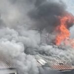 Simon Lane Kovan house fire with flames and smoke from roof