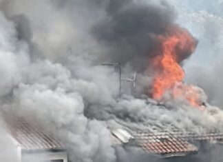 Simon Lane Kovan house fire with flames and smoke from roof