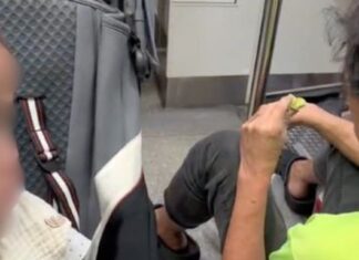 TikTok aftermath still of stranger on MRT floor beside toddler stroller after alleged half-eaten bun incident
