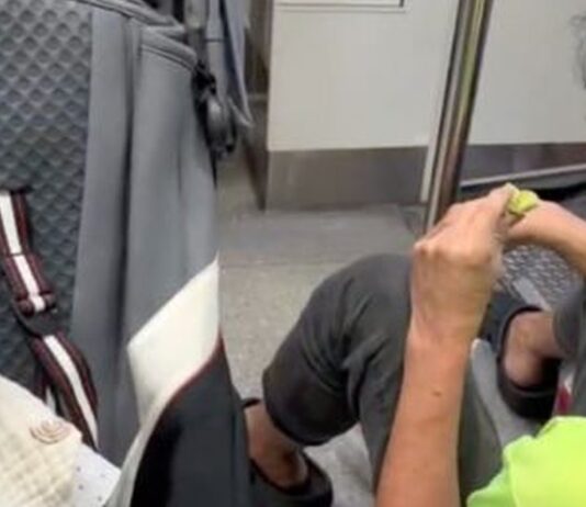 TikTok aftermath still of stranger on MRT floor beside toddler stroller after alleged half-eaten bun incident