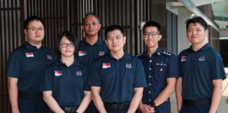 Singapore officers welcome-home / contingent photo or clearly non-literal disaster-relief stock (no wrong faces as named officers)