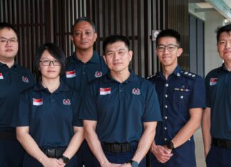 Singapore officers welcome-home / contingent photo or clearly non-literal disaster-relief stock (no wrong faces as named officers)