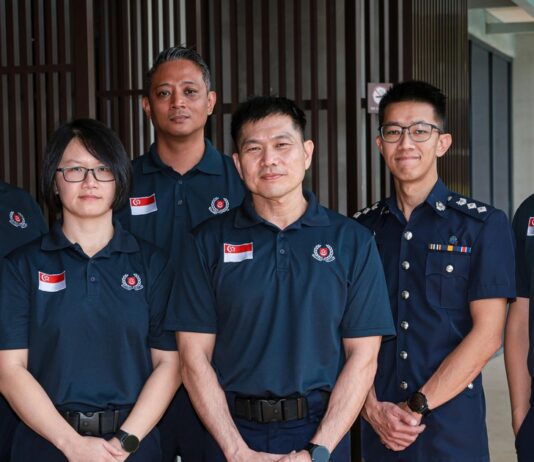 Singapore officers welcome-home / contingent photo or clearly non-literal disaster-relief stock (no wrong faces as named officers)
