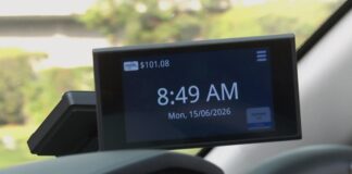 Singapore ERP 2.0 OBU touchscreen mounted on car dashboard