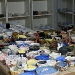 Unfinished pottery pieces left on tables and shelves at a Chinatown pottery studio