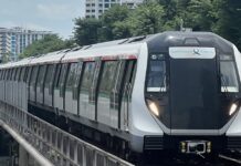 PSD Reviewing Paper Alleging Civil Servants Disproportionately Bought Homes Near Yet-Unannounced MRT Stations Singapore MRT train on elevated track with residential blocks behind