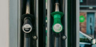 Diesel and unleaded petrol pump nozzles at a fuel station after Singapore price rise