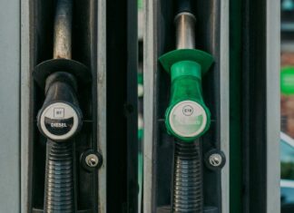 Diesel and unleaded petrol pump nozzles at a fuel station after Singapore price rise