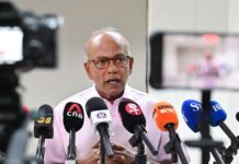 Police to Look Into Racist Comments About Singaporeans Missing in Nepal and SIA-Air India Issue Senior Minister K Shanmugam speaking at a media doorstop after directing police to investigate racist online comments
