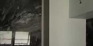 Dangling bathroom electrical wires during unfinished home renovation