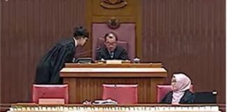 Parliament livestream still of Speaker Seah Kian Peng appearing to nod off in the Speakers chair